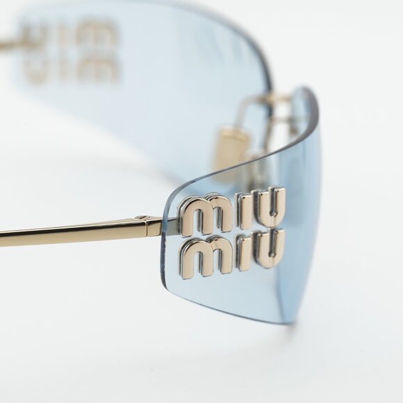 Miu Miu MUA51S ZVN10P Sunglasses Pale Gold Rectangle Frame, Light Blue Lenses